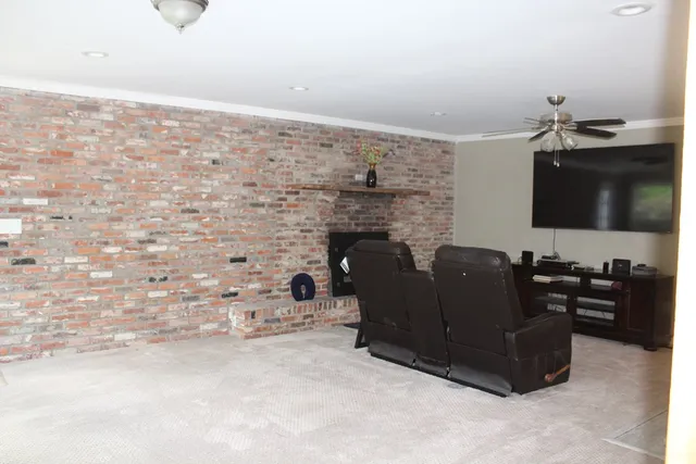 a bathroom with a granite countertop sink a large mirror and a window