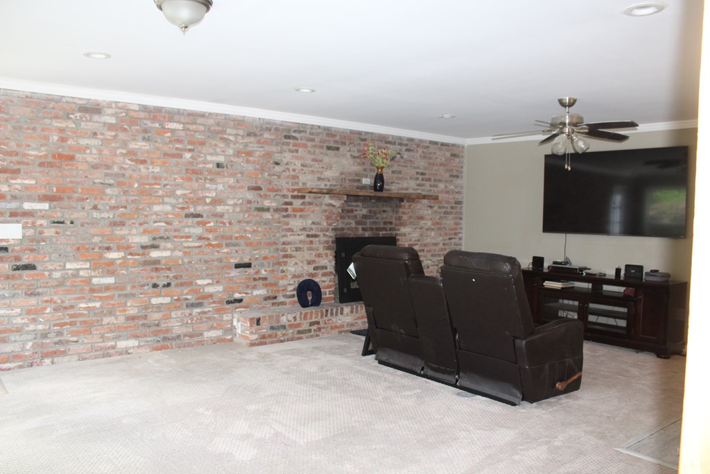 3710 Winkfield Place Columbus, GA 31909 - Photo 28 of 98 a living room with couches and a flat screen tv