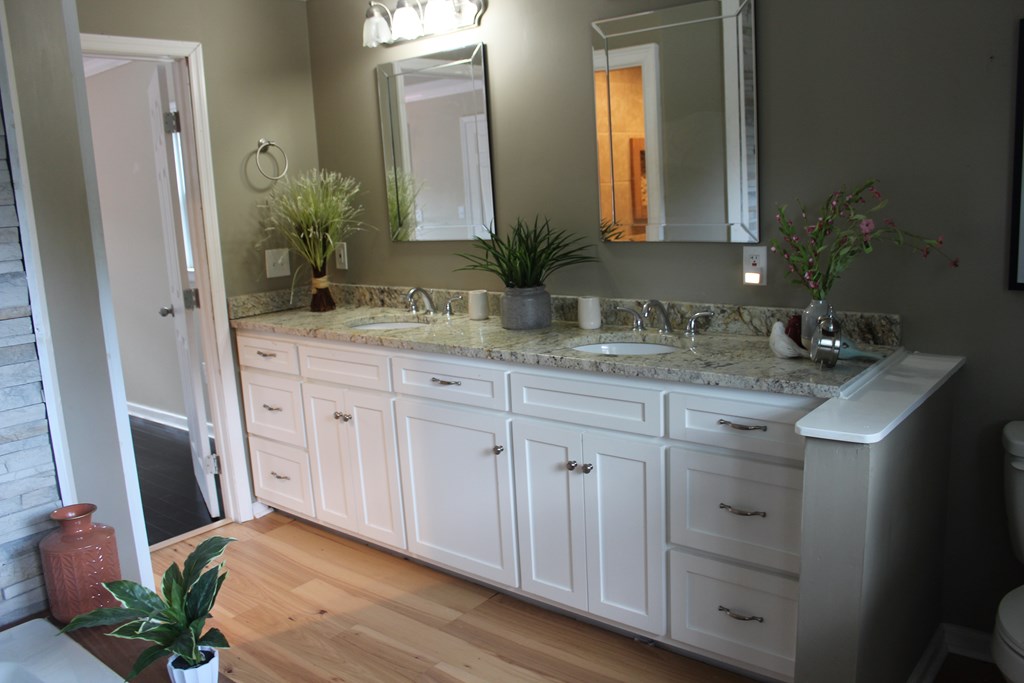 3710 Winkfield Place Columbus, GA 31909 - Photo 49 of 98 a bathroom with a granite countertop sink and a mirror