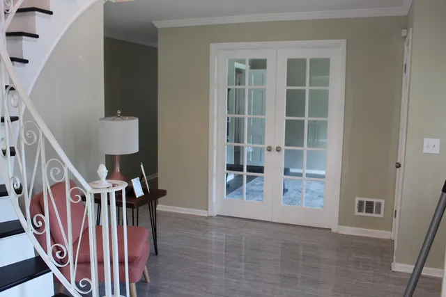 a kitchen with kitchen island granite countertop a sink a counter top space and cabinets
