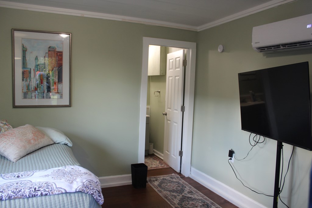 3710 Winkfield Place Columbus, GA 31909 - Photo 75 of 98 a bedroom with a bed and a mirror