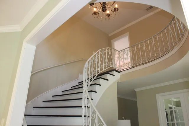 a view of kitchen with stainless steel appliances kitchen island a refrigerator and a stove