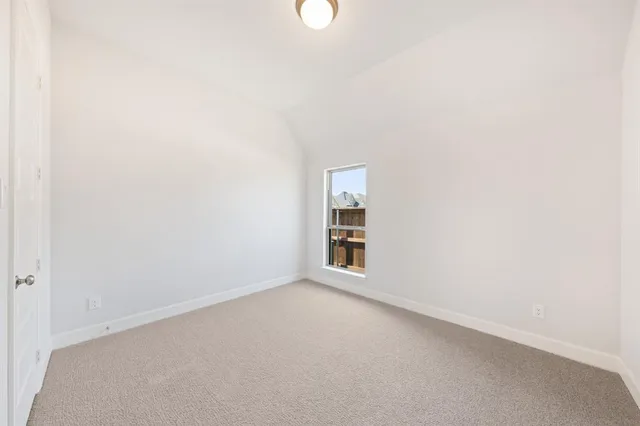 a en suite bathroom with a toilet sink and mirror