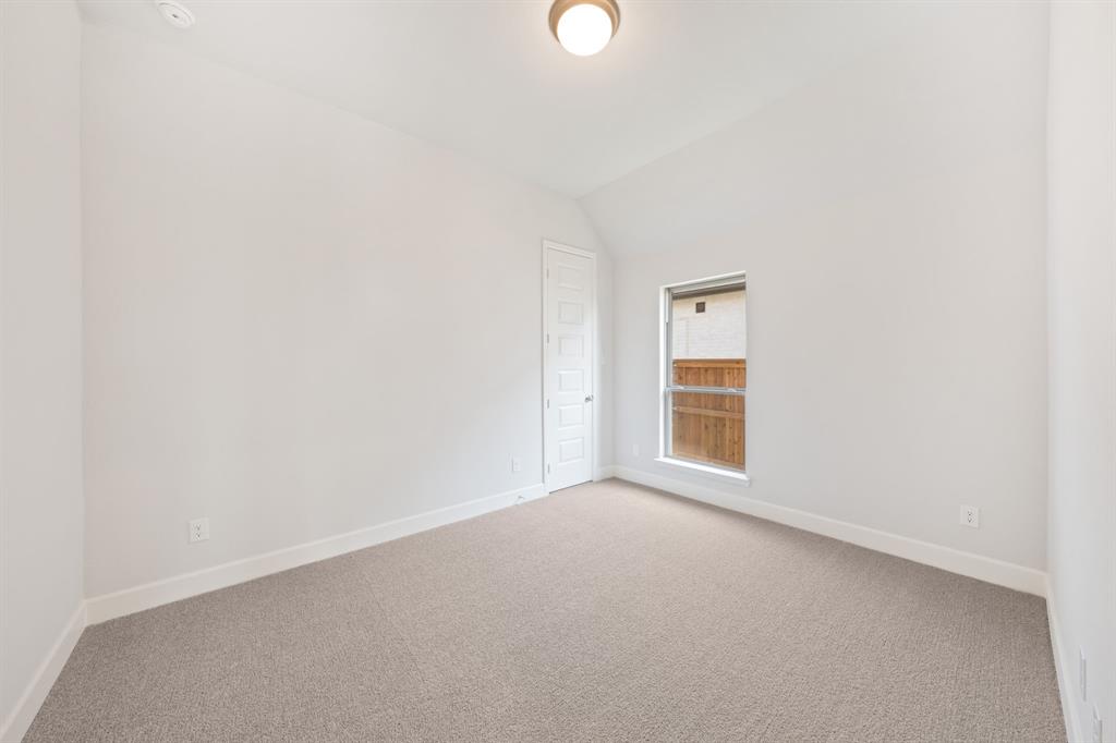 721 Running Iron Trail Mansfield, TX 76063 - Photo 17 of 23 a view of a small space with wooden floor and a window
