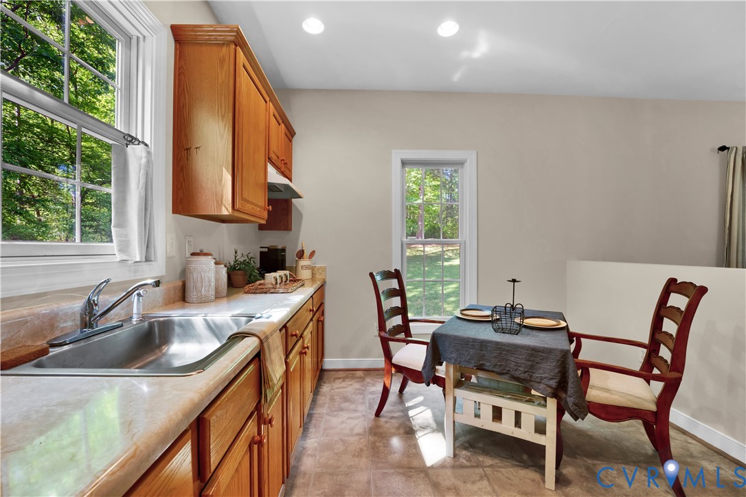 16148 Buckfast Place Beaverdam, VA 23015 - Photo 34 of 48 a kitchen with a stove a sink and a refrigerator