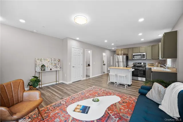 a bedroom with furniture and a wooden floor