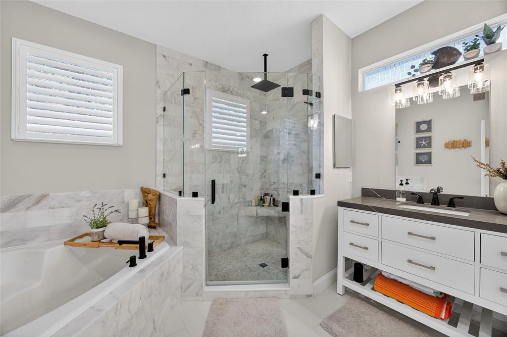 11550 Delwick Drive Windermere, FL 34786 - Photo 25 of 91 a bathroom with a double vanity sink mirror and shower