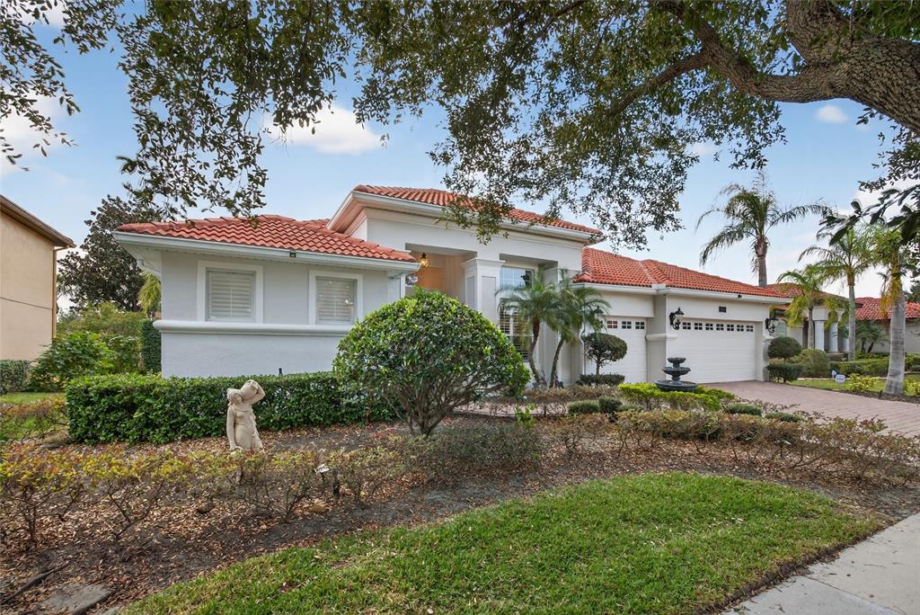 11550 Delwick Drive Windermere, FL 34786 - Photo 4 of 91 a house view with a garden space