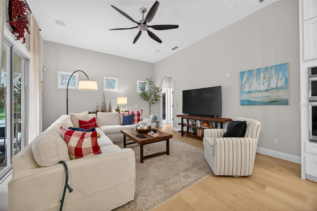11550 Delwick Drive Windermere, FL 34786 - Photo 48 of 91 a living room with furniture and a flat screen tv
