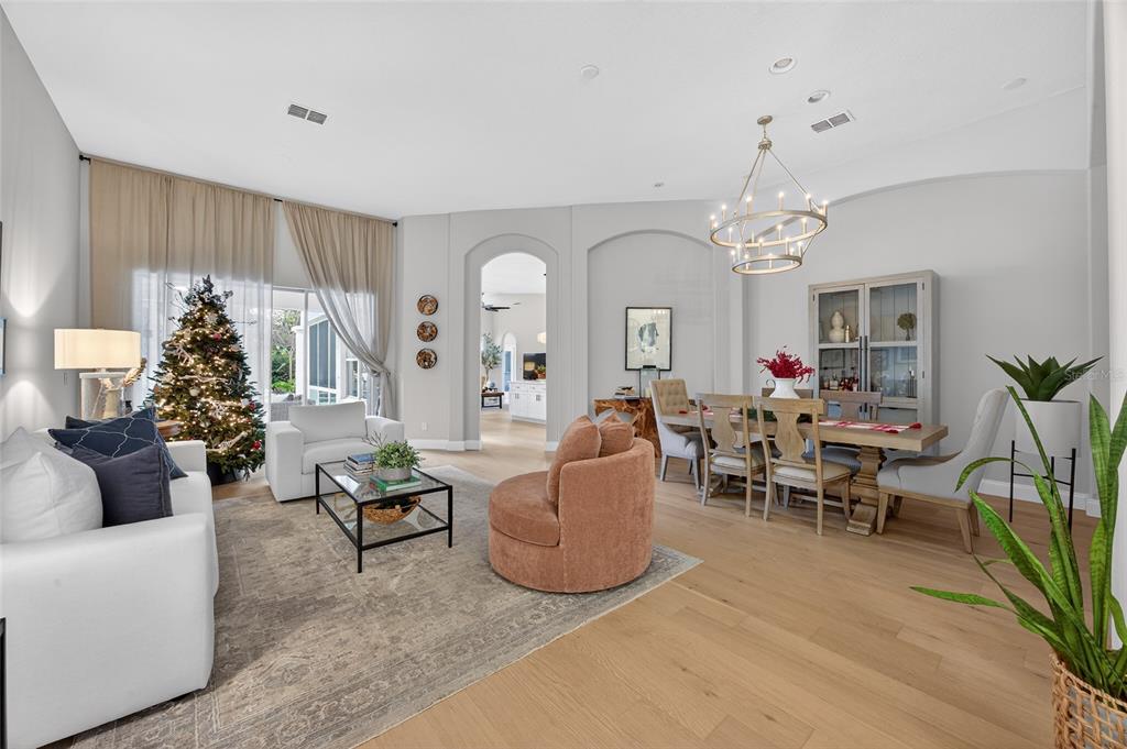 11550 Delwick Drive Windermere, FL 34786 - Photo 55 of 91 a living room with furniture and a chandelier