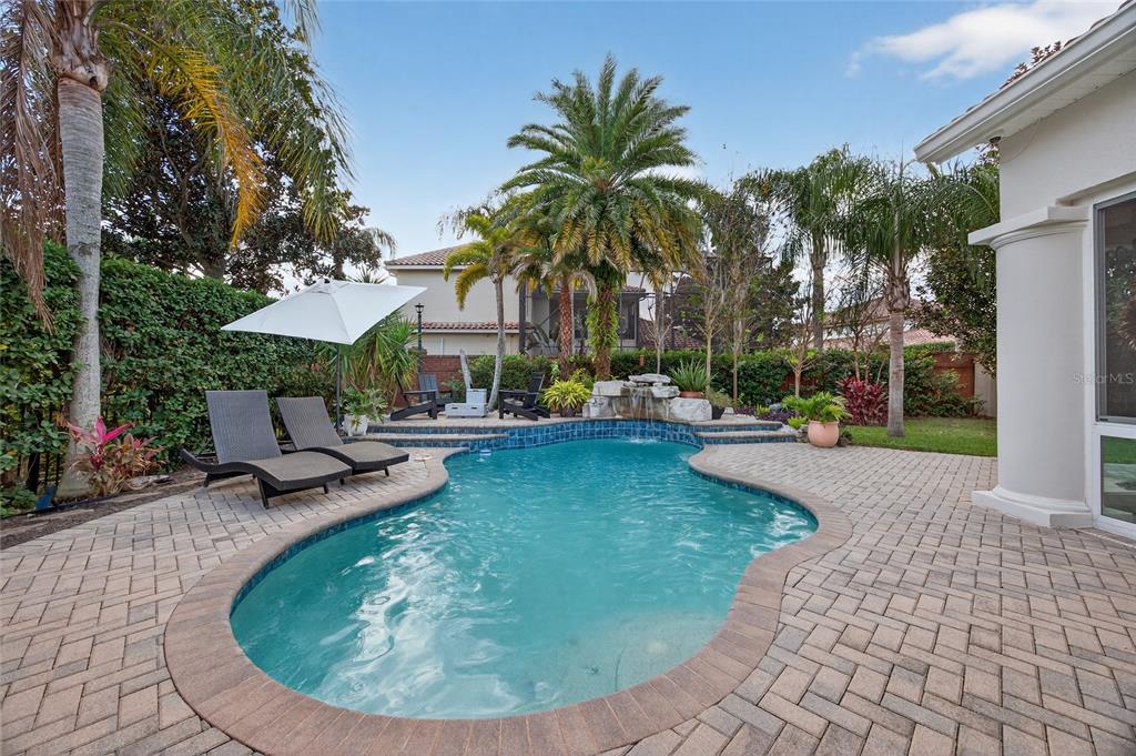 11550 Delwick Drive Windermere, FL 34786 - Photo 68 of 91 a view of a swimming pool with sitting area