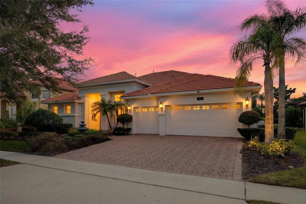 11550 Delwick Drive Windermere, FL 34786 - Photo 7 of 91 a front view of a house with a yard and garage
