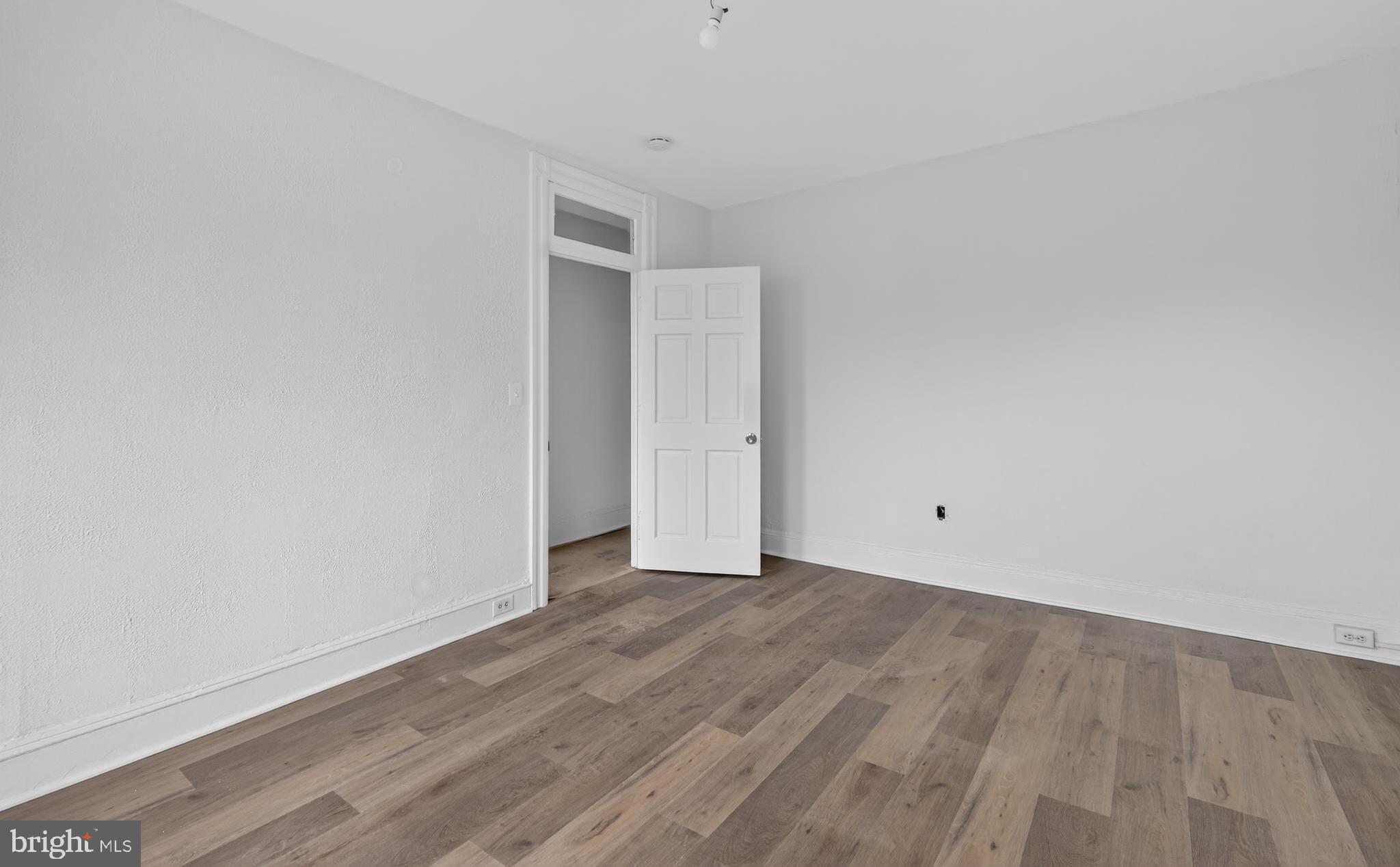 2032 North Capitol Street Northwest, Unit 2 Washington, DC 20002 - Photo 11 of 19 a view of an empty room with wooden floor