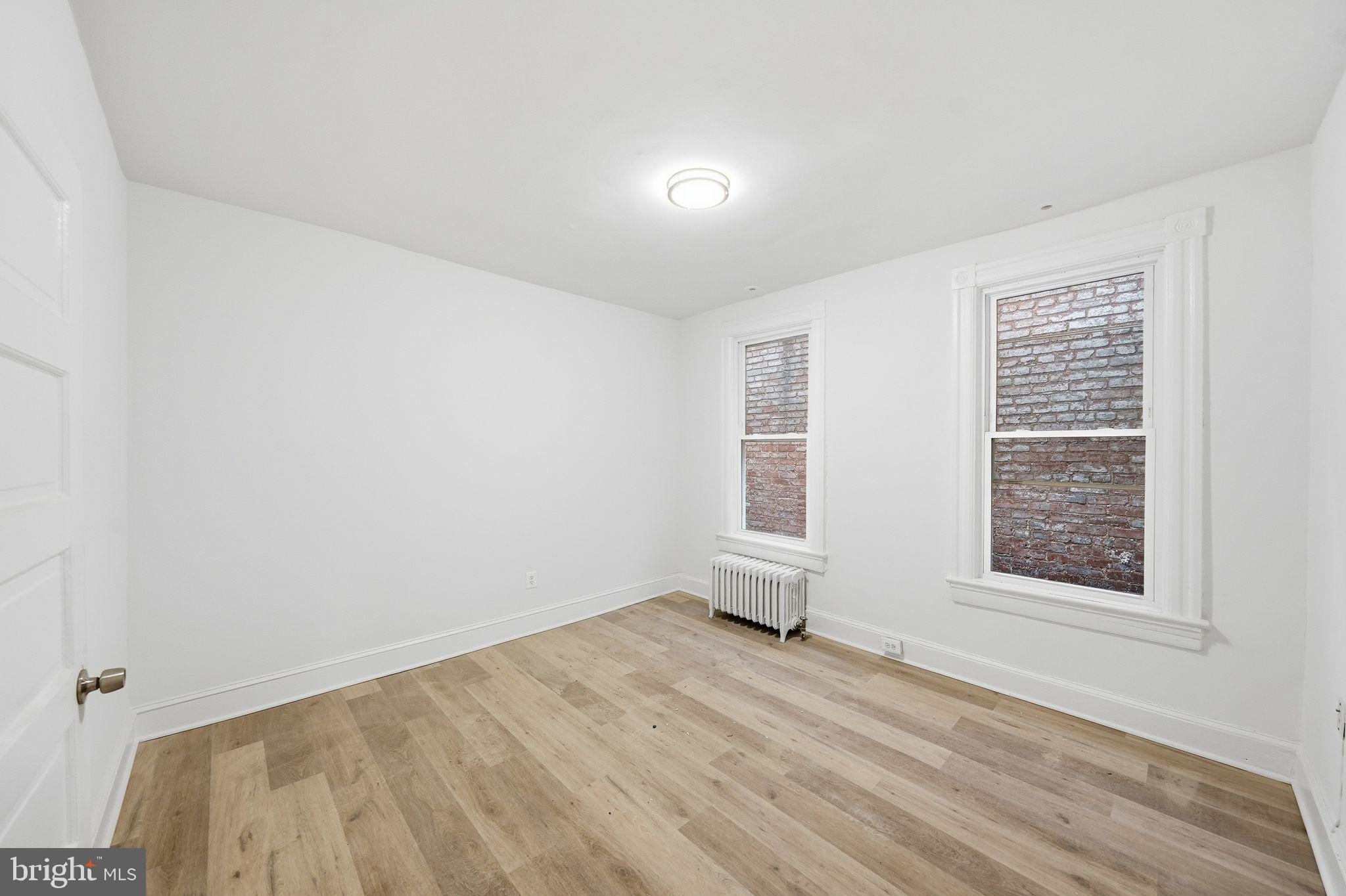 2032 North Capitol Street Northwest, Unit 2 Washington, DC 20002 - Photo 16 of 19 an empty room with windows