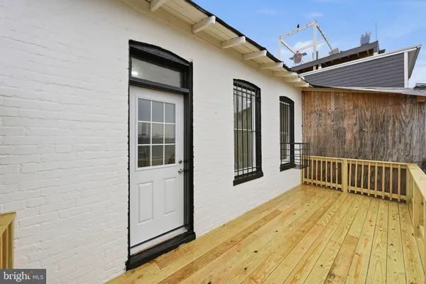 a view of balcony with wooden floor