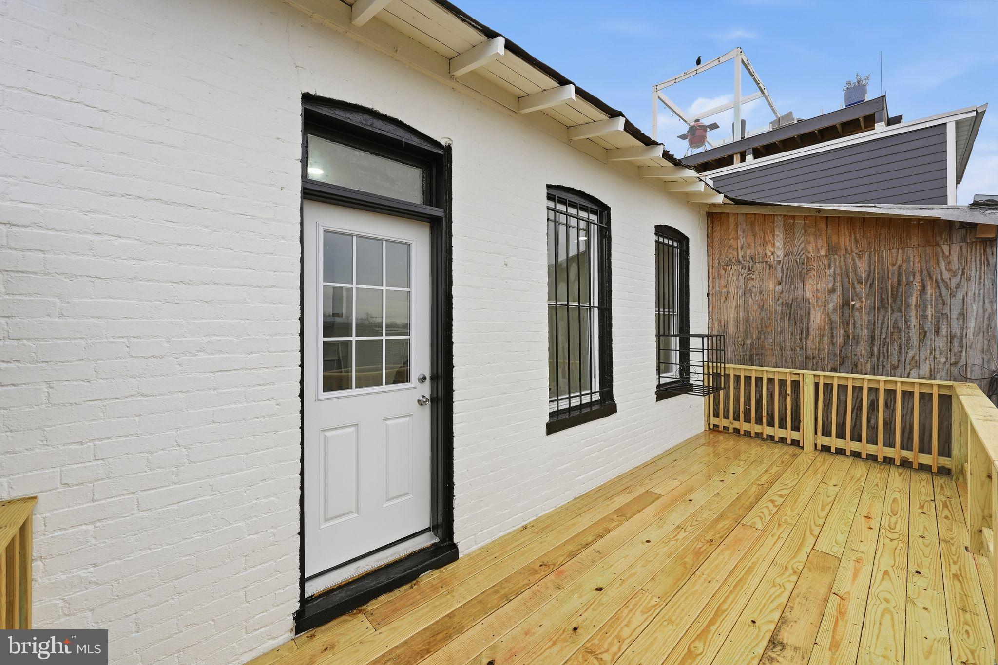 2032 North Capitol Street Northwest, Unit 2 Washington, DC 20002 - Photo 19 of 19 a view of balcony with wooden floor