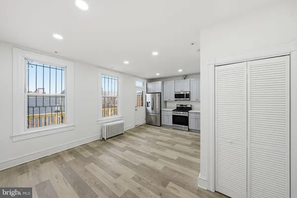 a view of an empty room with a window