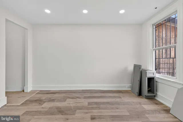 a view of an empty room with a window