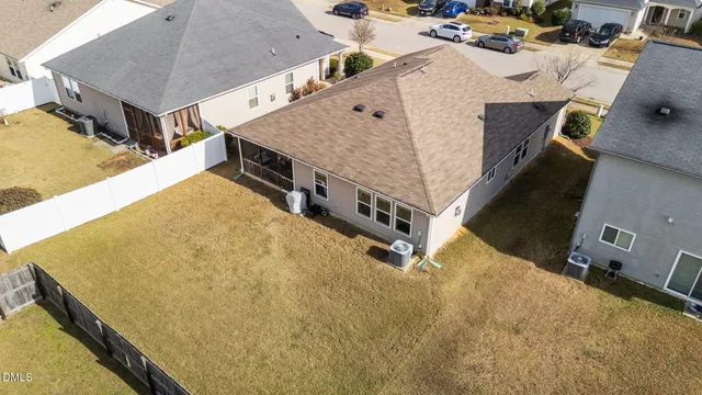 a living room with a table chairs and a bed