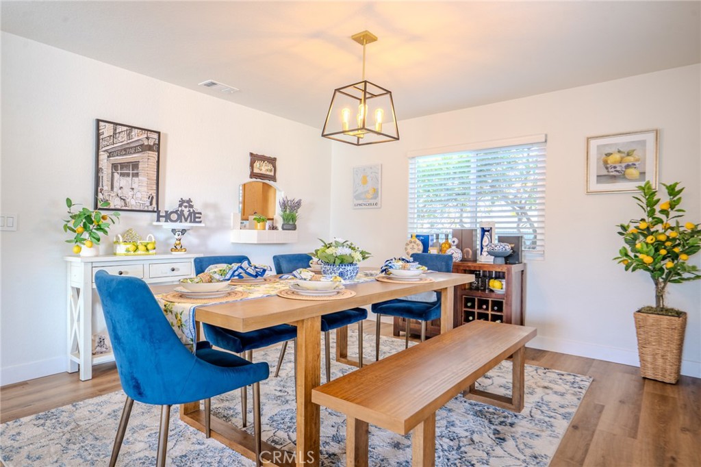 5039 West 134th Street Hawthorne, CA 90250 - Photo 11 of 30 a view of a dining room with furniture and wooden floor
