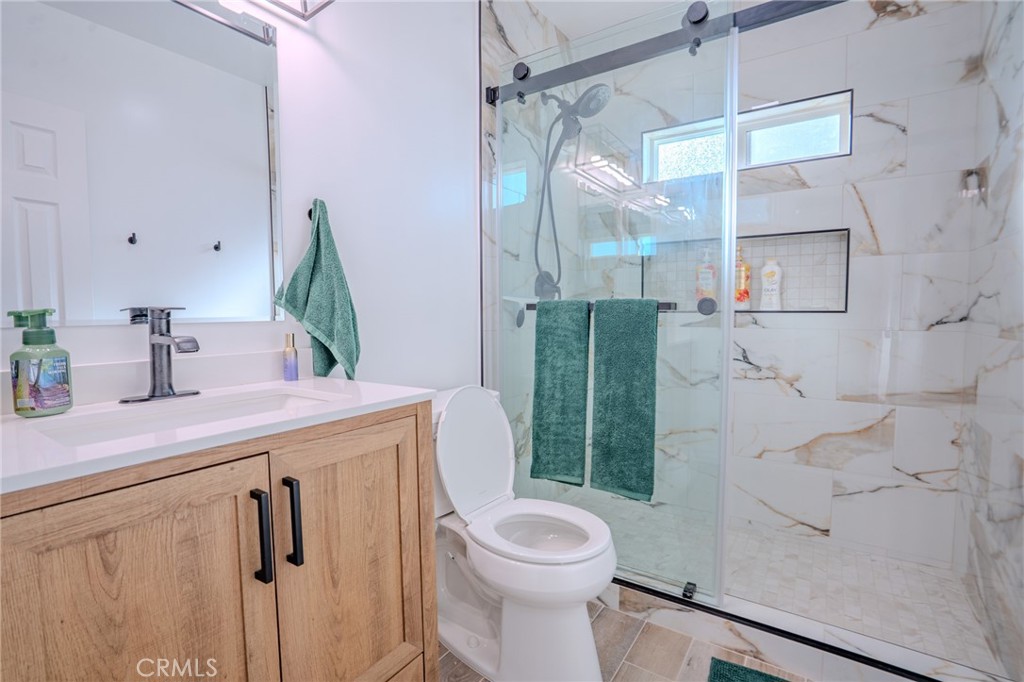 5039 West 134th Street Hawthorne, CA 90250 - Photo 12 of 30 a bathroom with a sink a toilet and shower