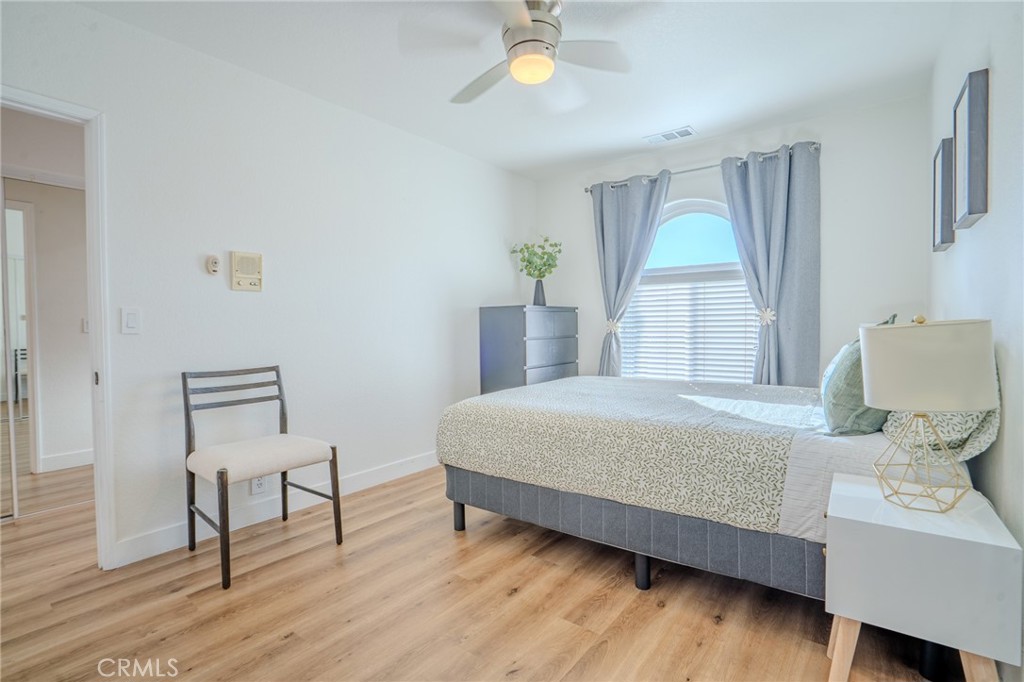 5039 West 134th Street Hawthorne, CA 90250 - Photo 13 of 30 a bedroom with a bed and a chandelier
