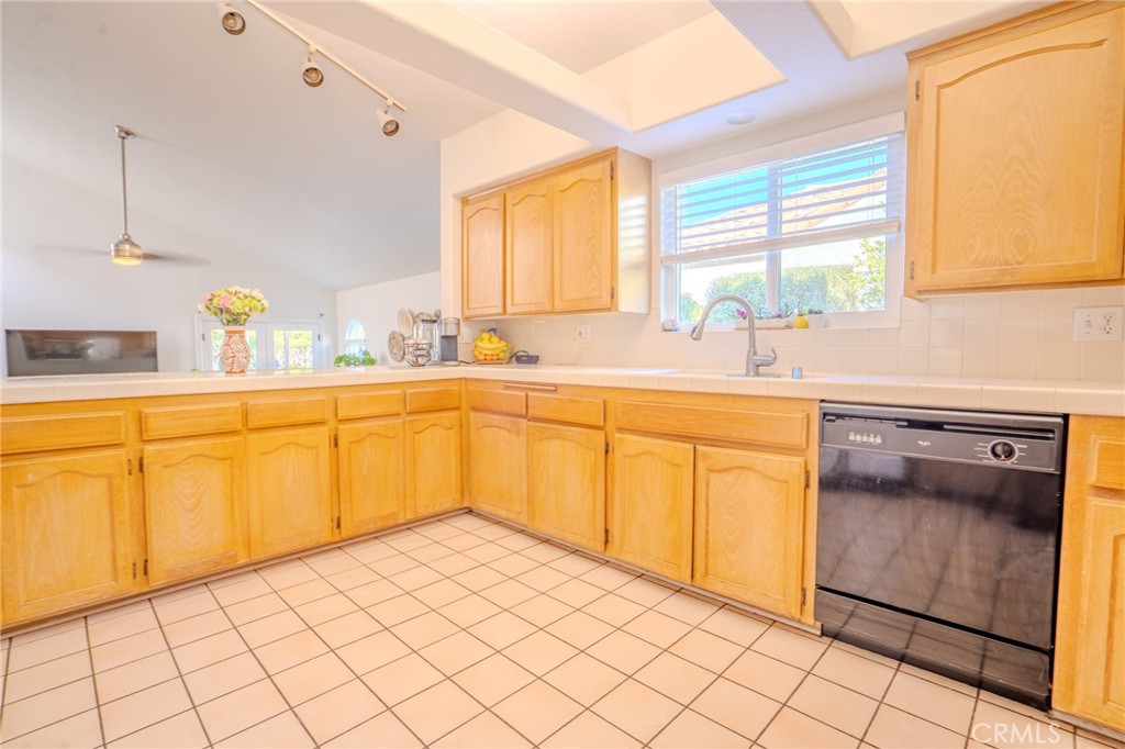 5039 West 134th Street Hawthorne, CA 90250 - Photo 14 of 30 a kitchen with a sink cabinets and window