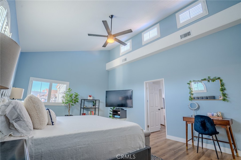 5039 West 134th Street Hawthorne, CA 90250 - Photo 19 of 30 a bedroom with a bed and a flat screen tv