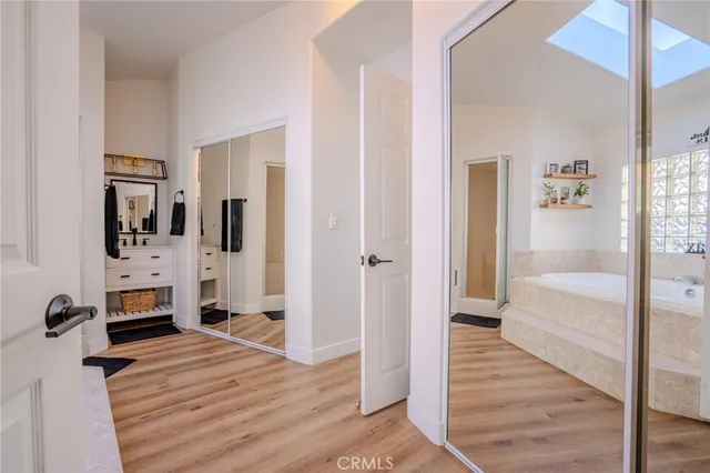 a spacious bathroom with a tub and shower