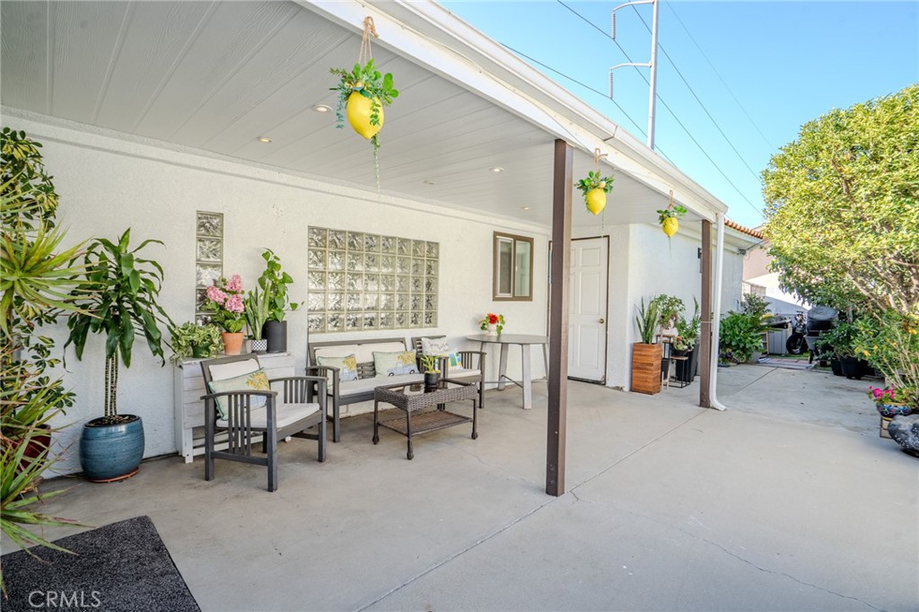 5039 West 134th Street Hawthorne, CA 90250 - Photo 27 of 30 a living room with furniture a potted plant and a table
