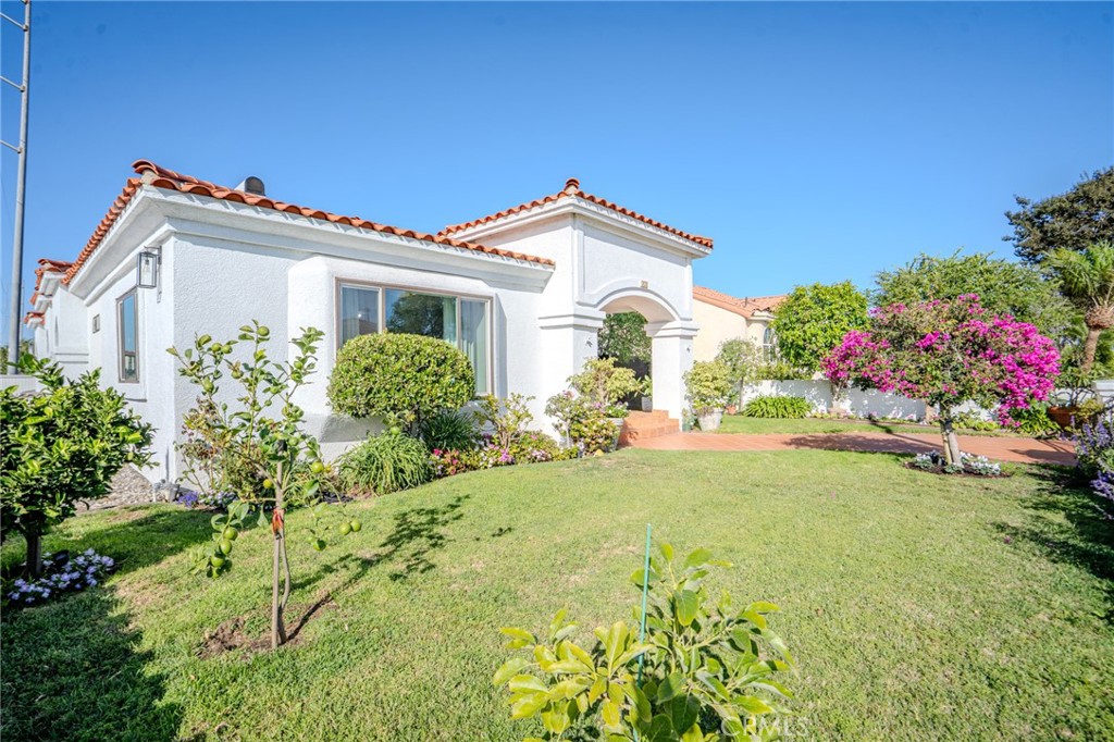 5039 West 134th Street Hawthorne, CA 90250 - Photo 3 of 30 a front view of a house with a garden