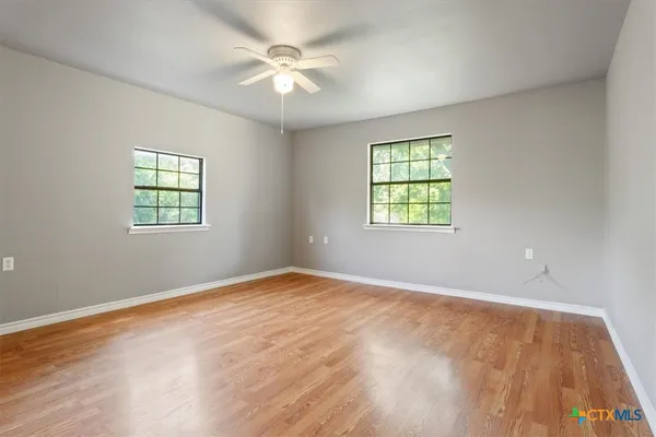 an empty room with windows