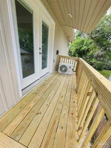 a view of a two chairs in the balcony