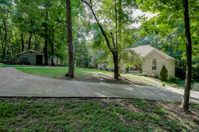 8805 Byrum Chapel Road Portland, TN 37148 - Photo 17 of 19 A private paved road, concrete driveway, 20x20 storage building with a concrete floor. Make an appointment today!