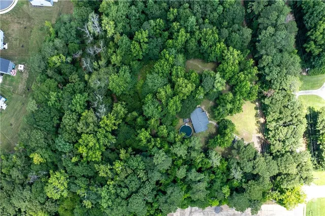 a backyard of a house with a yard and fountain