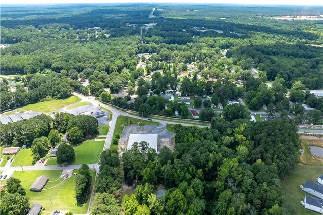 an aerial view of houses with yard and green space