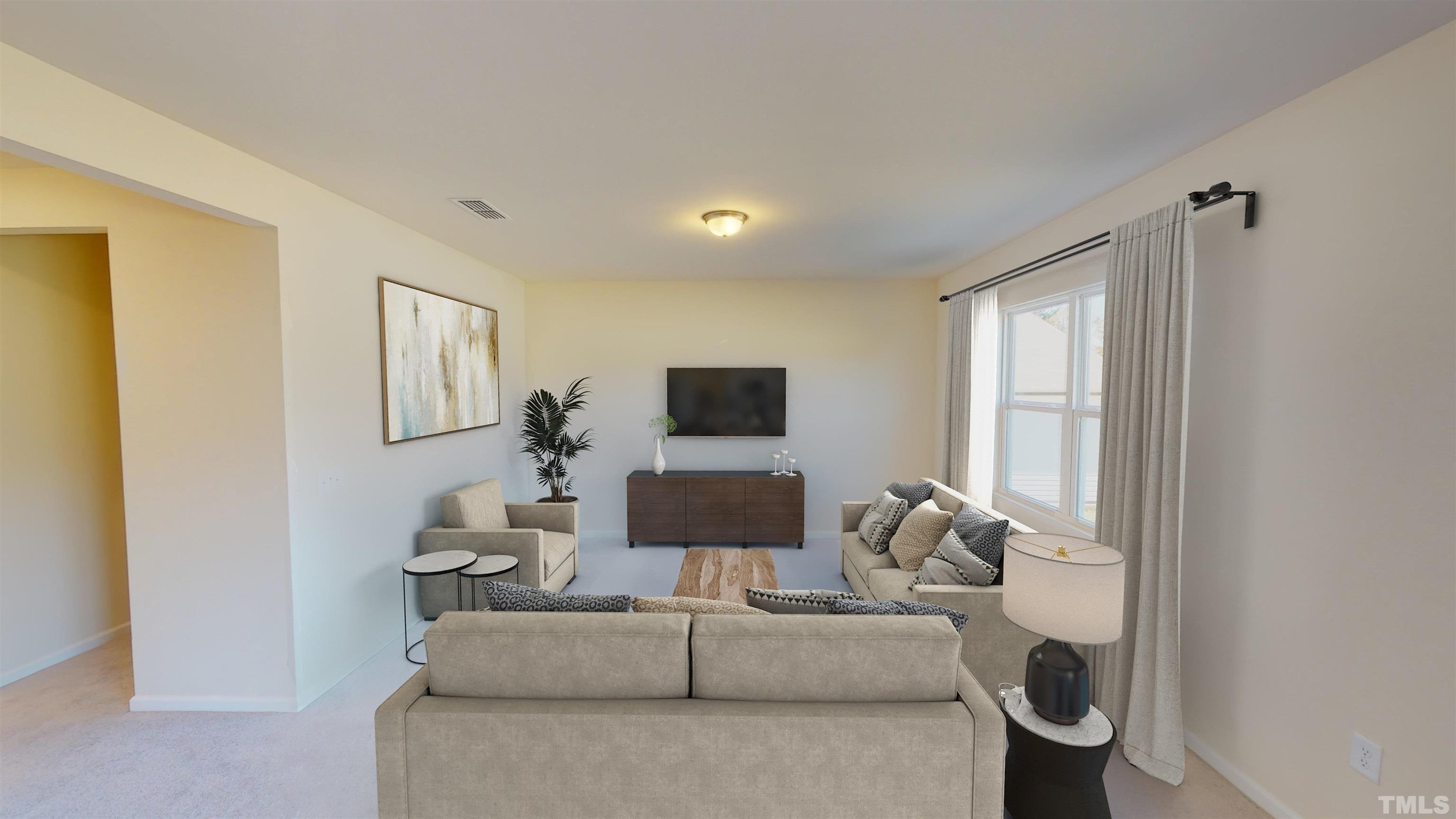 1624 Arapahoe Ridge Drive Raleigh, NC 27604 - Photo 11 of 12 a living room with furniture and a window