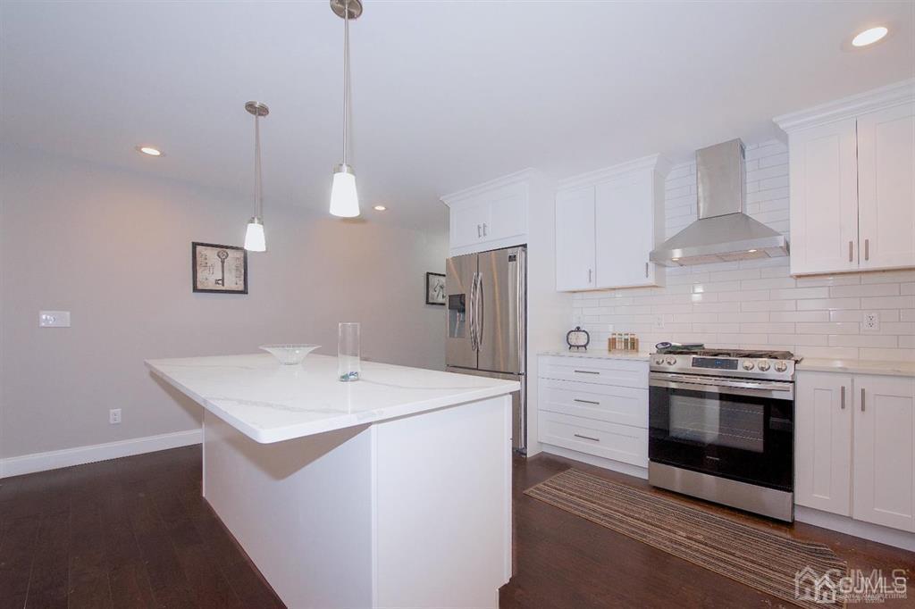 12 Cottrell Road Matawan, NJ 07747 - Photo 12 of 38 a kitchen that has a sink a stove and a microwave