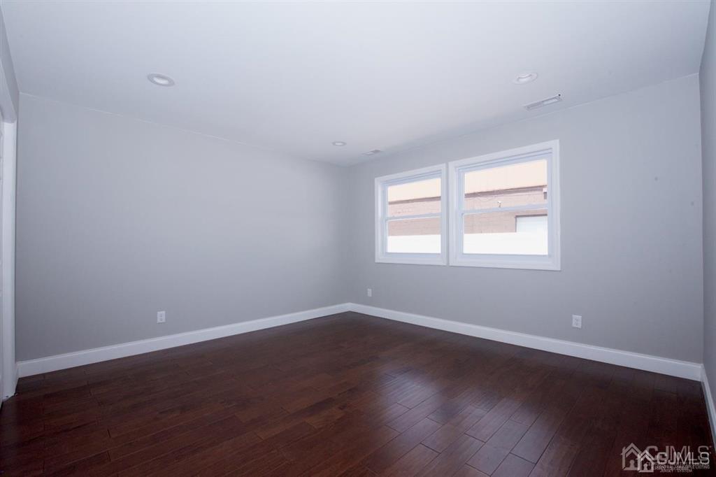 12 Cottrell Road Matawan, NJ 07747 - Photo 18 of 38 a view of a room with wooden floor and windows in it