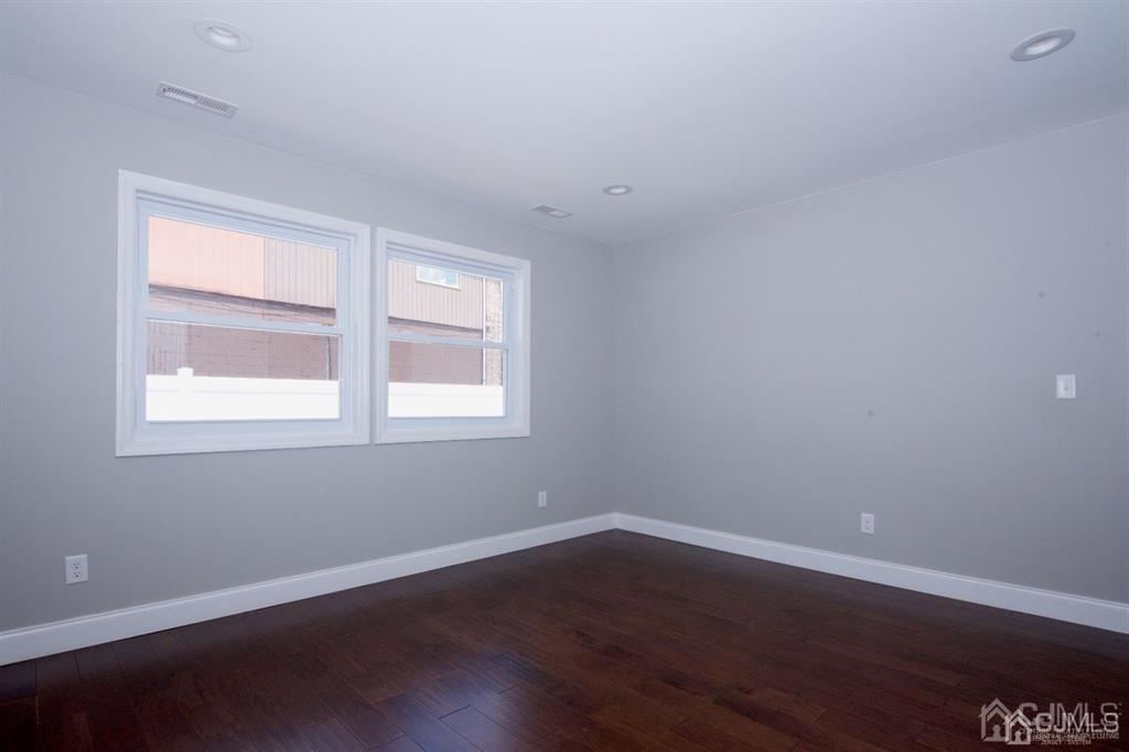 12 Cottrell Road Matawan, NJ 07747 - Photo 19 of 38 a view of a room with wooden floor and windows in it