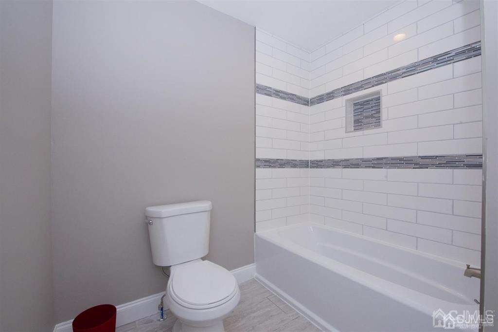 12 Cottrell Road Matawan, NJ 07747 - Photo 25 of 38 a bathroom with a toilet and a bathtub