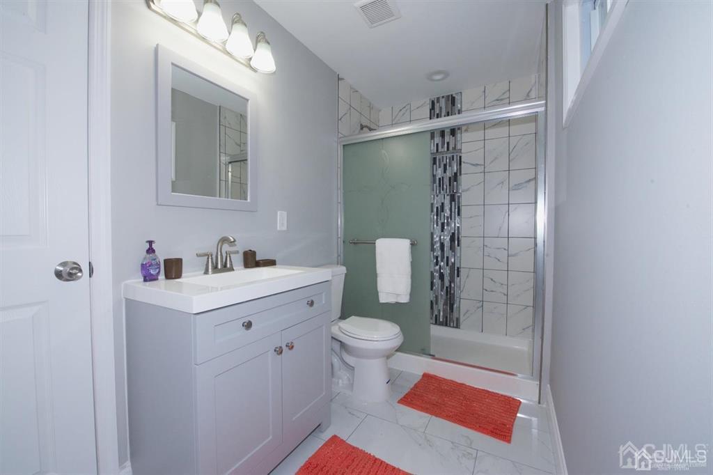 12 Cottrell Road Matawan, NJ 07747 - Photo 30 of 38 a bathroom with a sink toilet and shower
