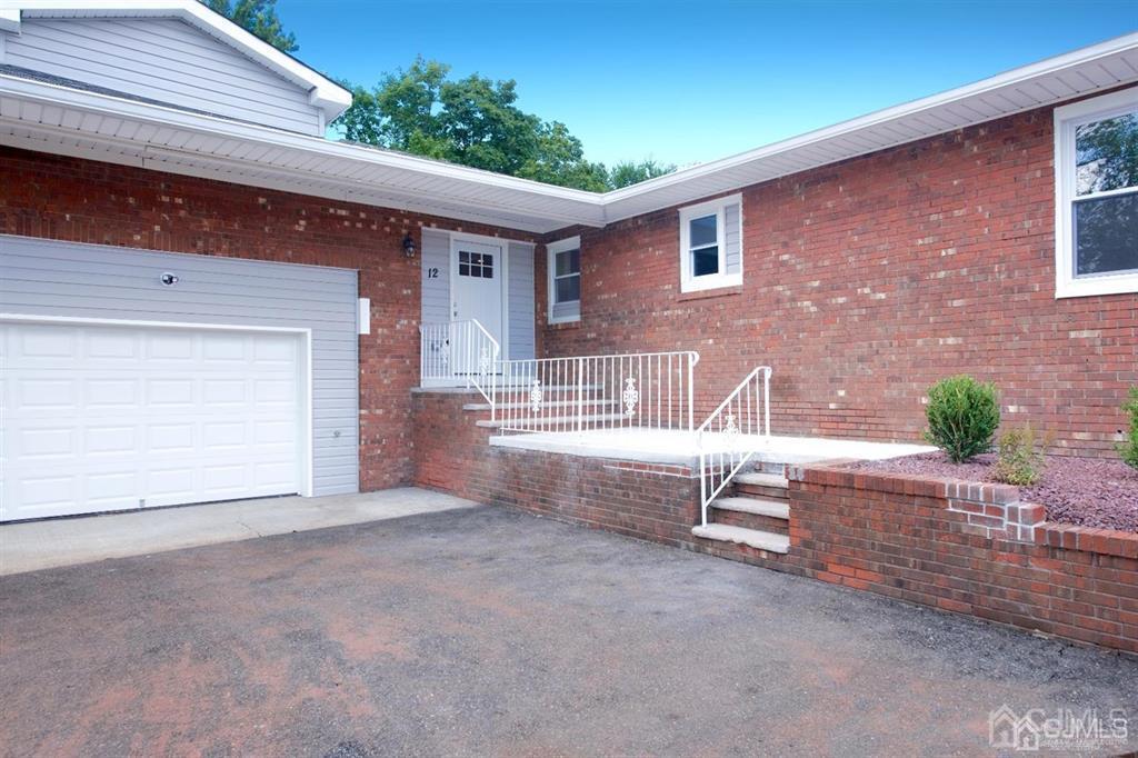 12 Cottrell Road Matawan, NJ 07747 - Photo 3 of 38 a view of a house with a patio and a yard