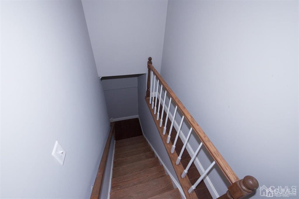 12 Cottrell Road Matawan, NJ 07747 - Photo 32 of 38 a view of a hallway with wooden floor