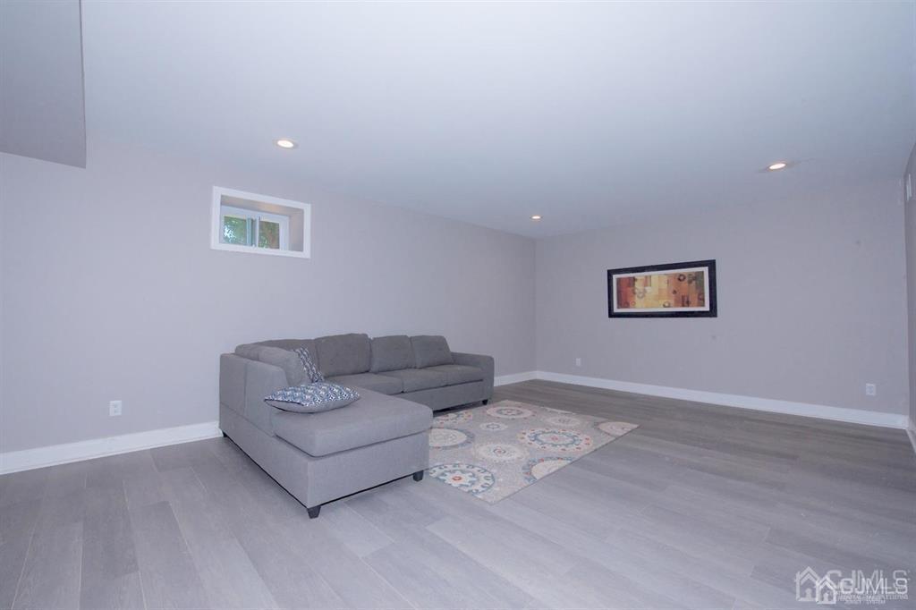 12 Cottrell Road Matawan, NJ 07747 - Photo 34 of 38 a living room with furniture and a wooden floor