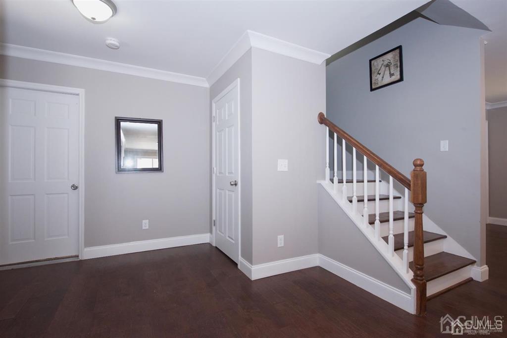 12 Cottrell Road Matawan, NJ 07747 - Photo 4 of 38 a view of a hallway with staircase