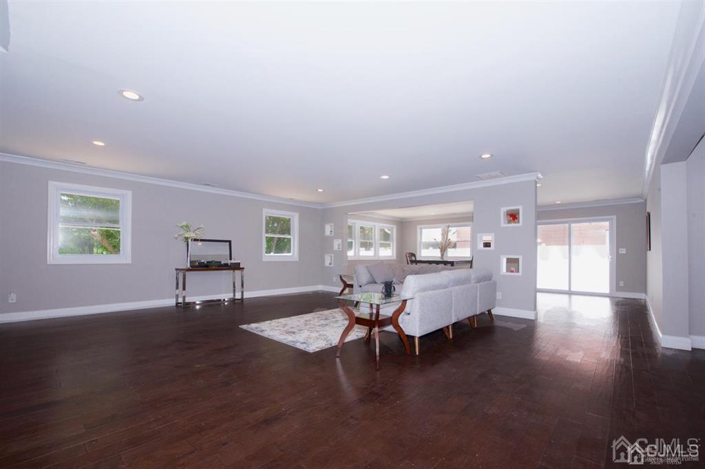 12 Cottrell Road Matawan, NJ 07747 - Photo 6 of 38 a living room with furniture and a wooden floor