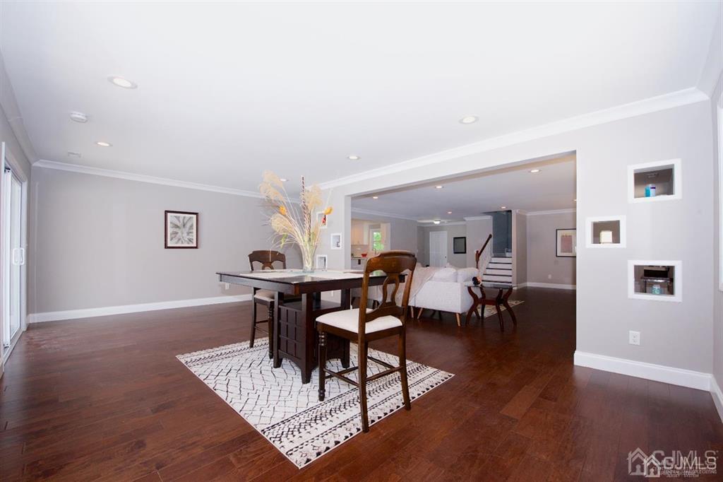12 Cottrell Road Matawan, NJ 07747 - Photo 8 of 38 a view of a dining room with furniture and wooden floor