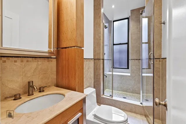 a kitchen with stainless steel appliances granite countertop a stove and a refrigerator