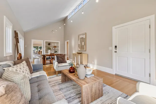 a kitchen with stainless steel appliances granite countertop a refrigerator sink and stove